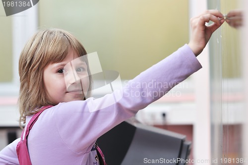 Image of happy school girl on math classes