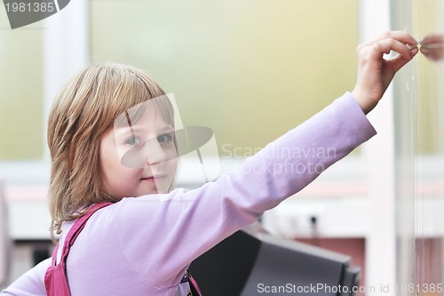 Image of happy school girl on math classes