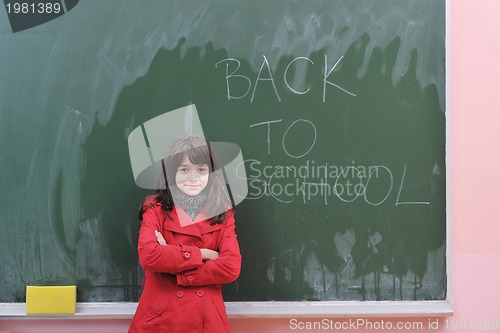 Image of happy school girl on math classes