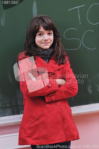 Image of happy school girl on math classes