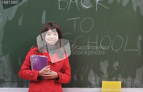Image of happy school girl on math classes