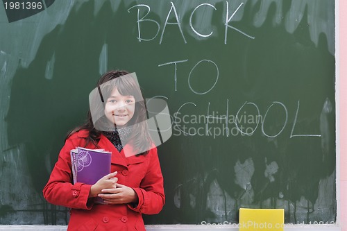 Image of happy school girl on math classes