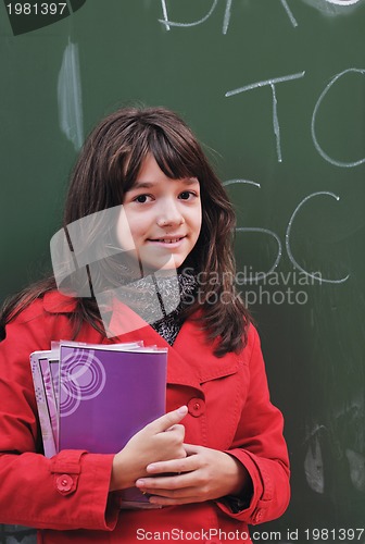 Image of happy school girl on math classes