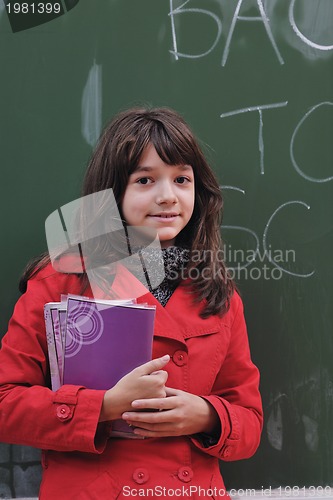 Image of happy school girl on math classes