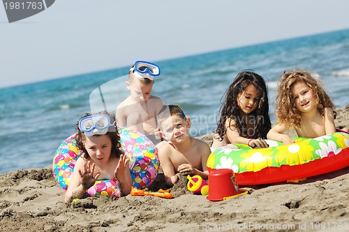 Image of child group have fun and play with beach toys