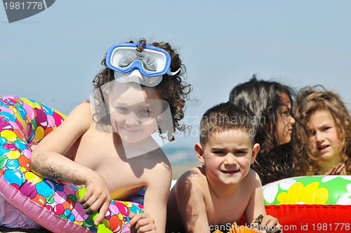 Image of child group have fun and play with beach toys