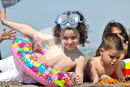 Image of child group have fun and play with beach toys