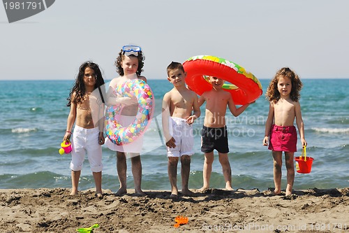 Image of child group have fun and play with beach toys
