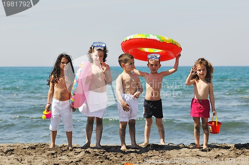 Image of child group have fun and play with beach toys
