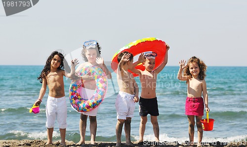 Image of child group have fun and play with beach toys
