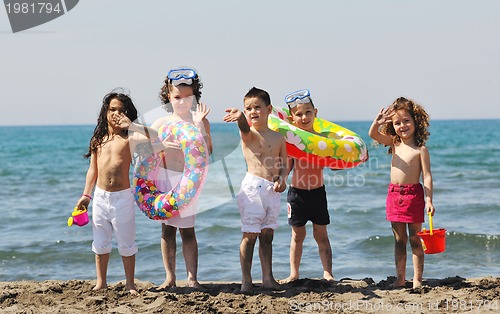 Image of child group have fun and play with beach toys