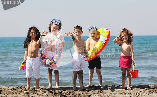 Image of child group have fun and play with beach toys