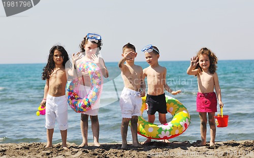 Image of child group have fun and play with beach toys
