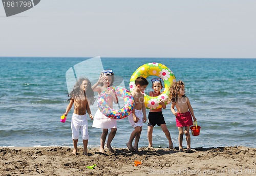 Image of child group have fun and play with beach toys