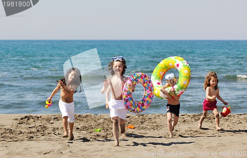 Image of child group have fun and play with beach toys