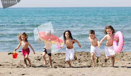 Image of child group have fun and play with beach toys