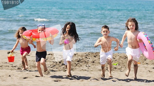 Image of child group have fun and play with beach toys