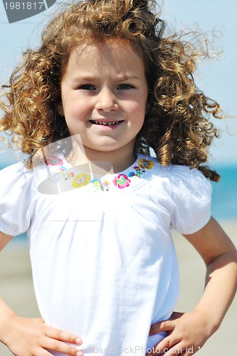 Image of little female  child portrait on the beach