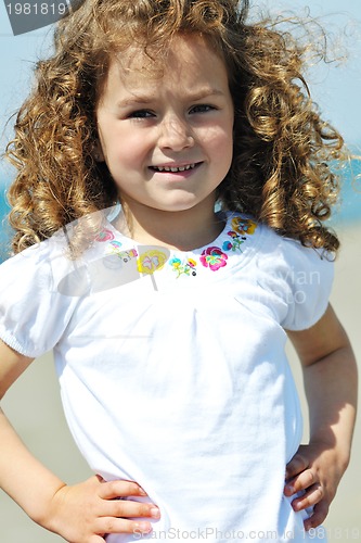 Image of little female  child portrait on the beach