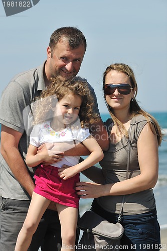 Image of happy young family have fun on beach