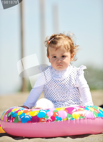 Image of little female  child portrait on the beach