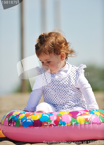Image of little female  child portrait on the beach
