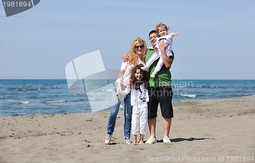 Image of happy young family have fun on beach