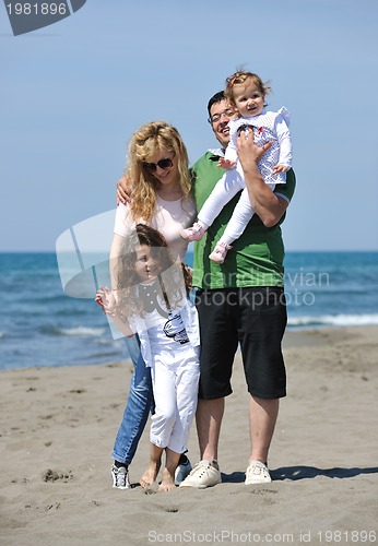 Image of happy young family have fun on beach