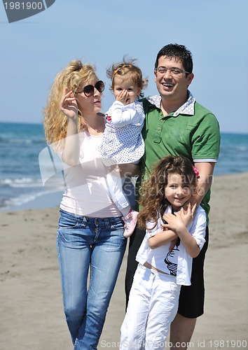Image of happy young family have fun on beach