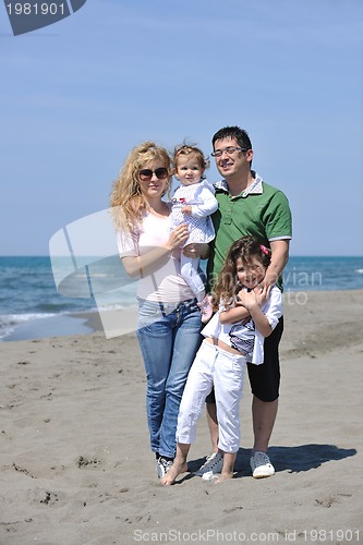 Image of happy young family have fun on beach