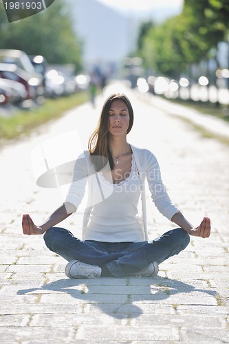 Image of yoga at sunny street