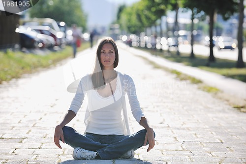 Image of yoga at sunny street