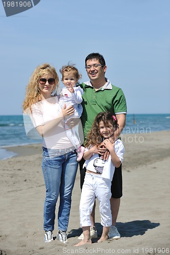 Image of happy young family have fun on beach