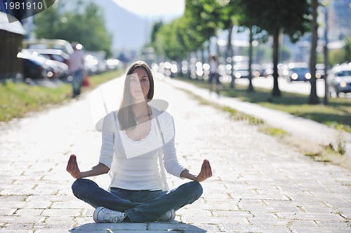 Image of yoga at sunny street