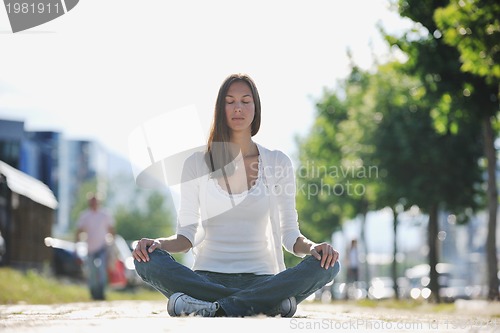 Image of yoga at sunny street