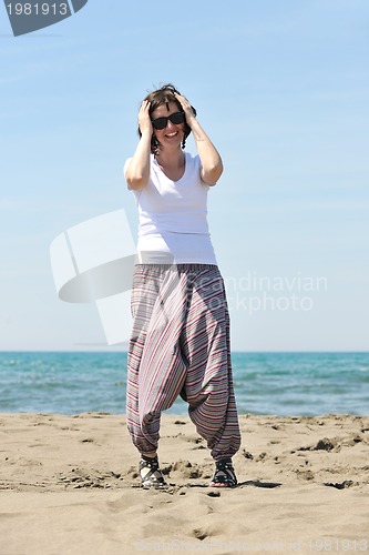 Image of young woman relax  on beach