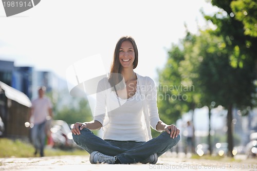 Image of yoga at sunny street