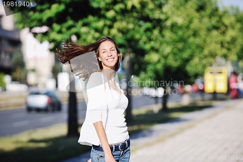 Image of young woman havefun at street 