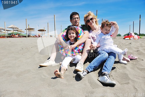 Image of happy young family have fun on beach