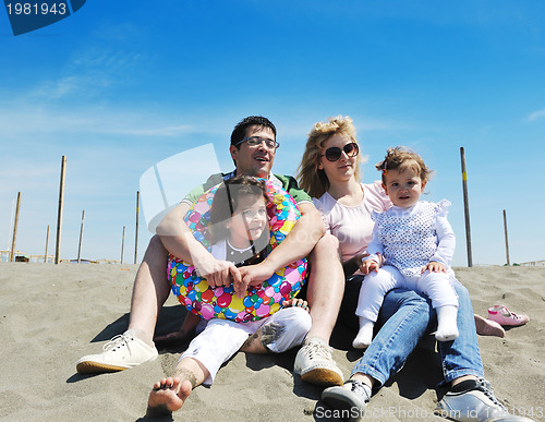 Image of happy young family have fun on beach