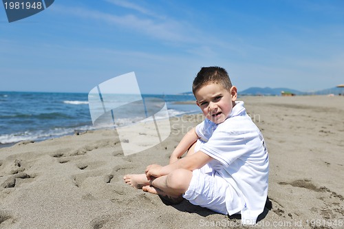 Image of happy child group playing  on beach