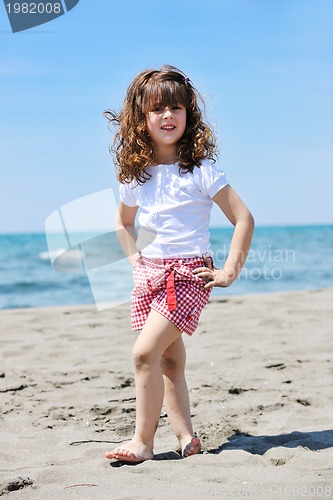 Image of little female  child portrait on the beach