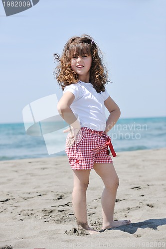 Image of little female  child portrait on the beach