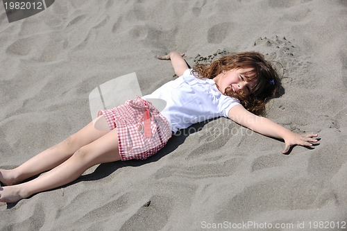 Image of little female  child portrait on the beach