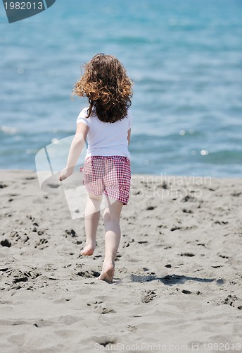 Image of little female  child portrait on the beach