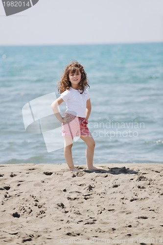 Image of little female  child portrait on the beach