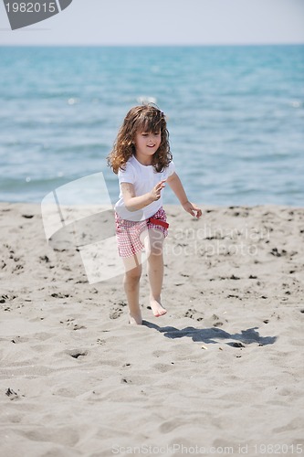 Image of little female  child portrait on the beach