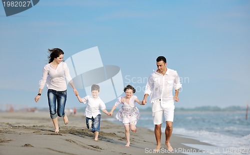 Image of happy young family have fun on beach