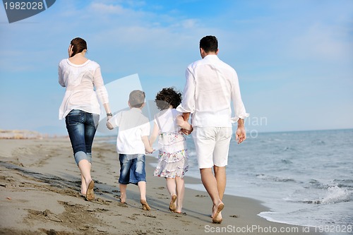 Image of happy young family have fun on beach