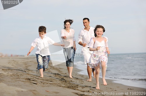Image of happy young family have fun on beach